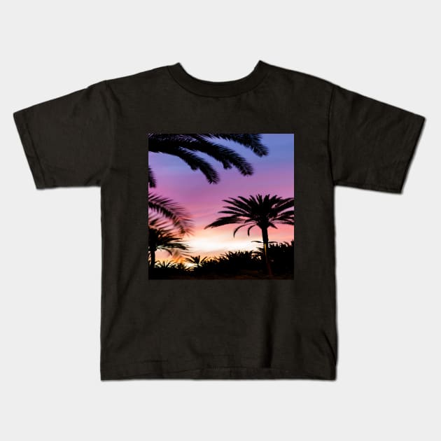 Silhouette of Palm Trees Kids T-Shirt by Vinit53